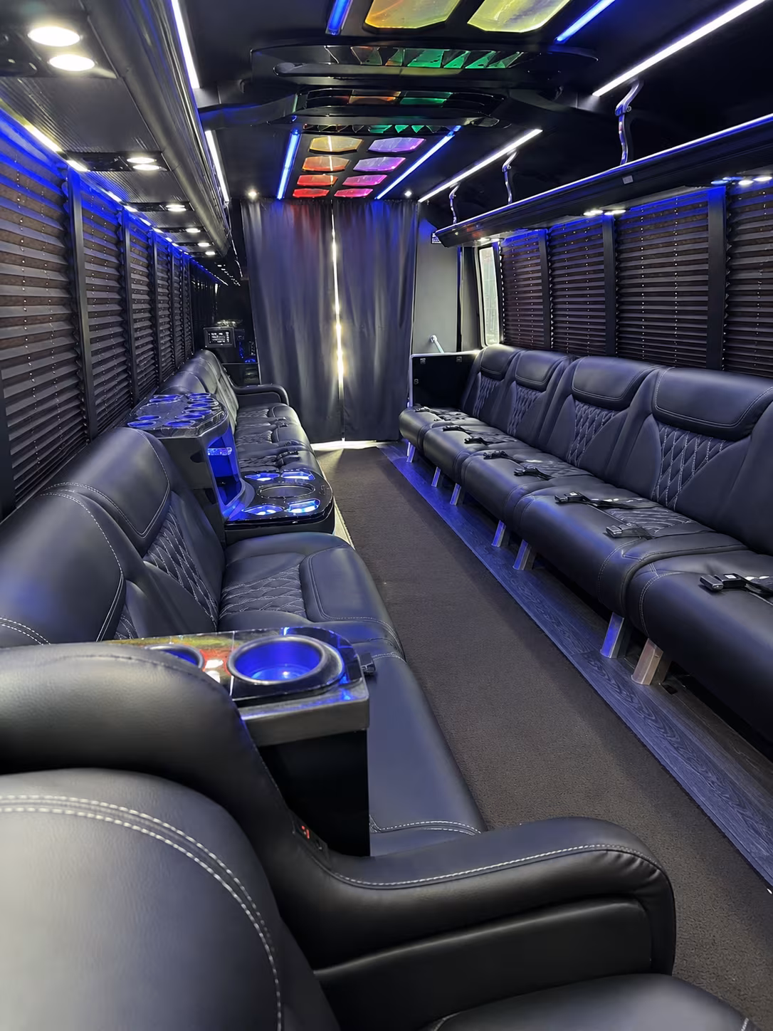 Wedding guests seated inside a party bus serving Charleston